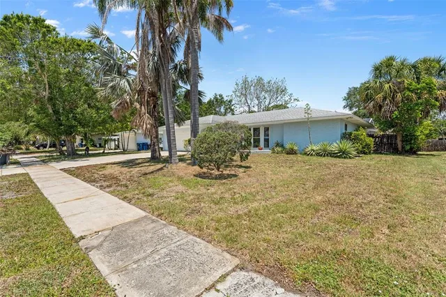 an aerial view of a house with outdoor space