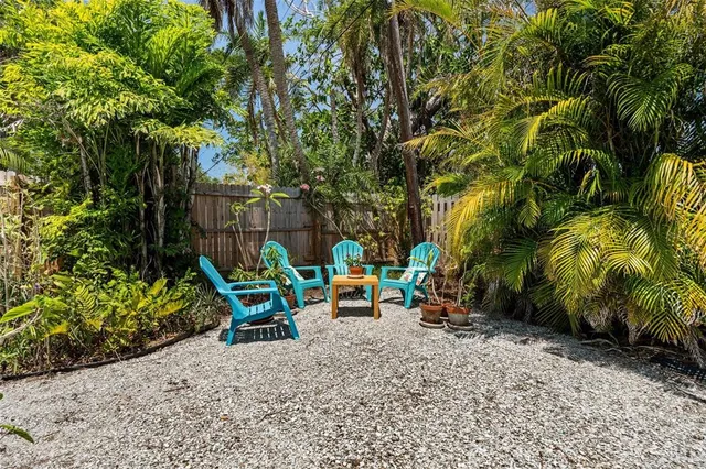 a living room with furniture and a lamp