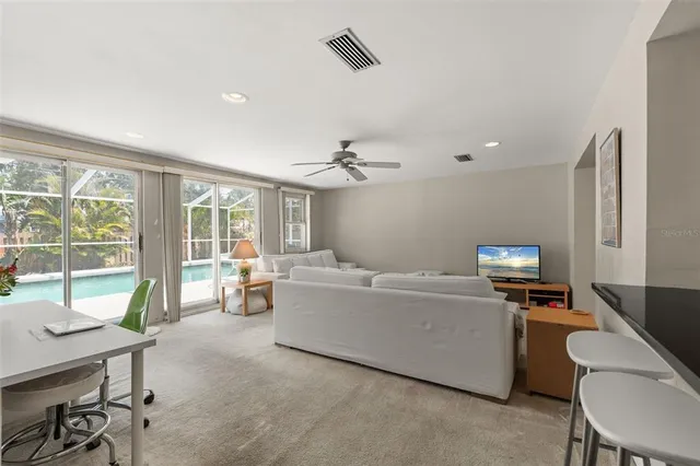 a living room with furniture white walls and white walls