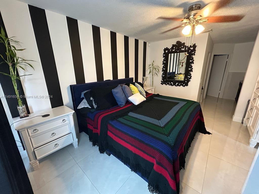 Marbella Park Hialeah, FL 33015 - Photo 13 of 24 a living room with furniture and a window