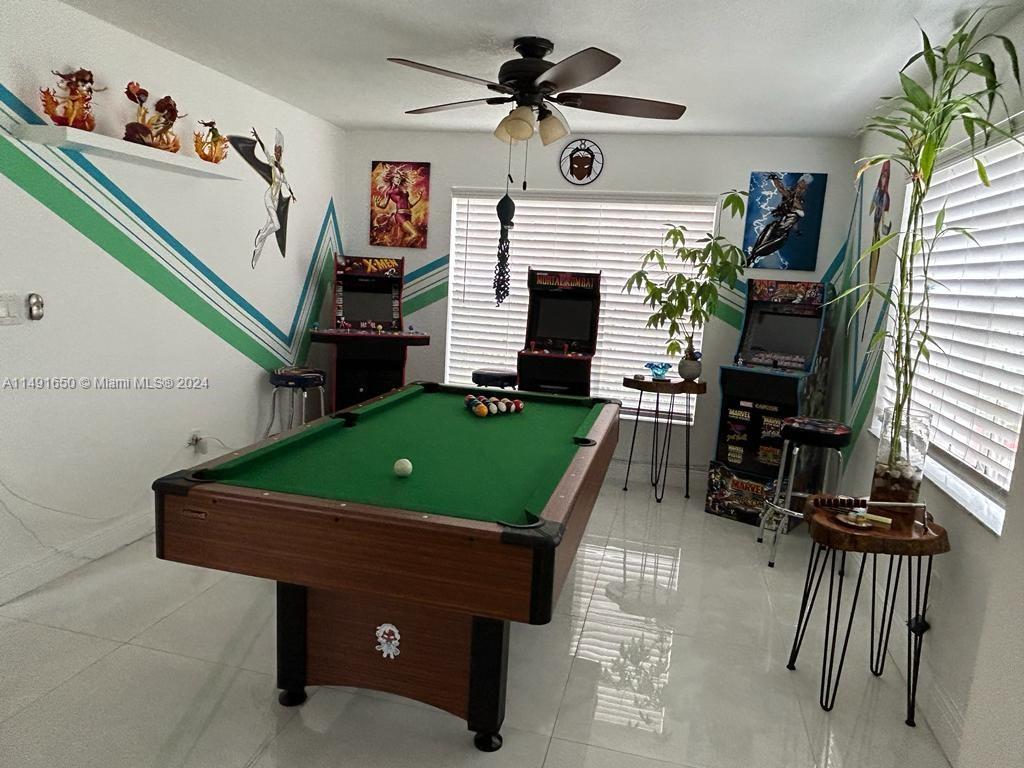 Marbella Park Hialeah, FL 33015 - Photo 22 of 24 a room with furniture and a fireplace