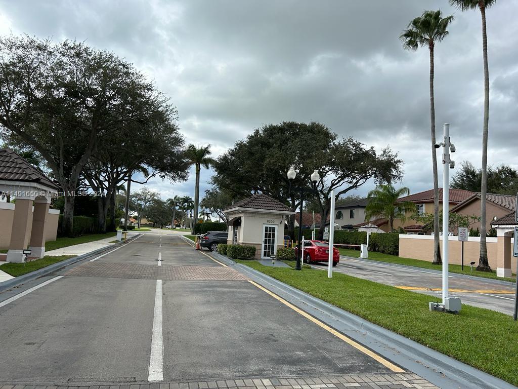 Marbella Park Hialeah, FL 33015 - Photo 24 of 24 a front view of a house with a yard and garage