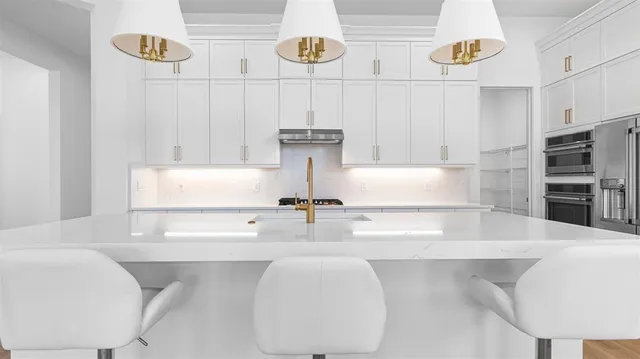 a bathroom with a bathtub and a sink