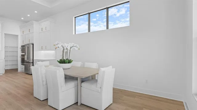 a view of kitchen with furniture and wooden floor