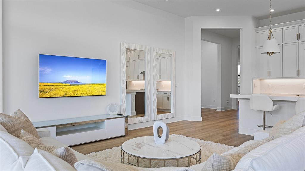 1520 Southeast Savoy Way Stuart, FL 34997 - Photo 15 of 39 a living room with furniture and a fireplace