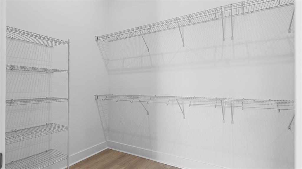 1520 Southeast Savoy Way Stuart, FL 34997 - Photo 20 of 37 a view of a room with racks on the wall