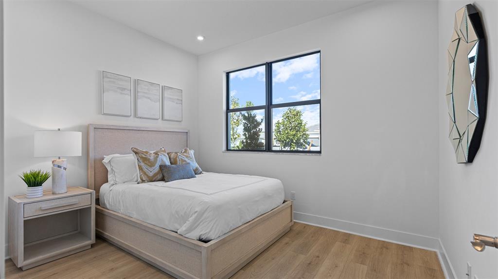 1520 Southeast Savoy Way Stuart, FL 34997 - Photo 23 of 37 a bedroom with a bed and a window