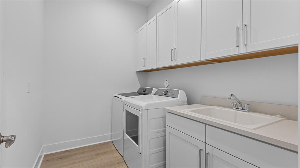 1520 Southeast Savoy Way Stuart, FL 34997 - Photo 26 of 39 a utility room with dryer and washer