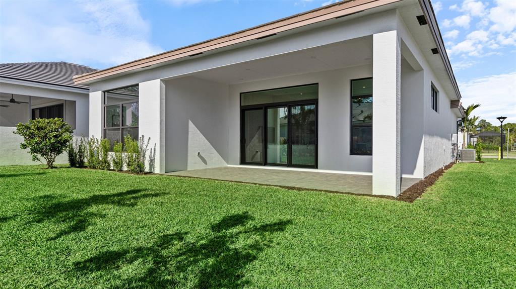 1520 Southeast Savoy Way Stuart, FL 34997 - Photo 32 of 37 a view of an house with backyard space and garden