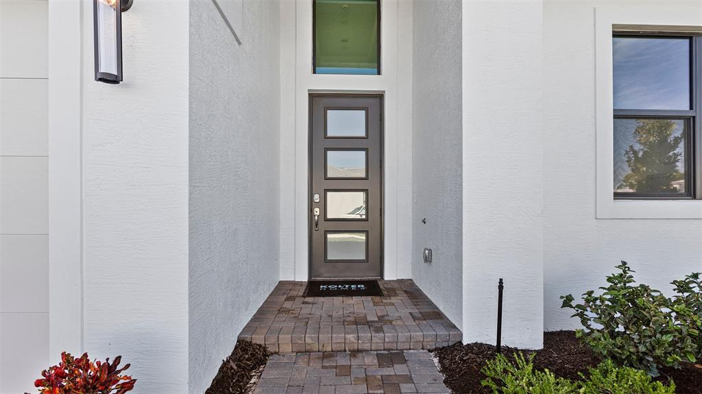 1520 Southeast Savoy Way Stuart, FL 34997 - Photo 5 of 39 a view of an entryway door