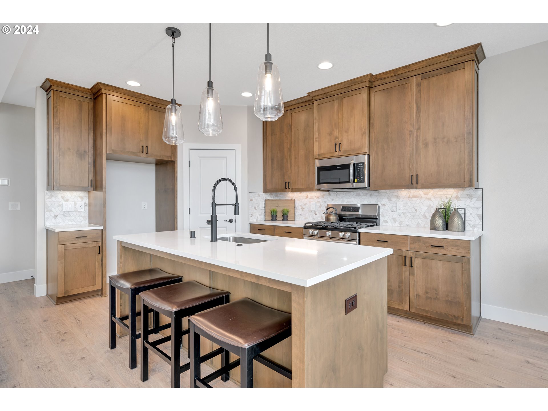 17538 Northwest 7th Avenue Ridgefield, WA 98642 - Photo 5 of 18 a kitchen with a sink cabinets and window