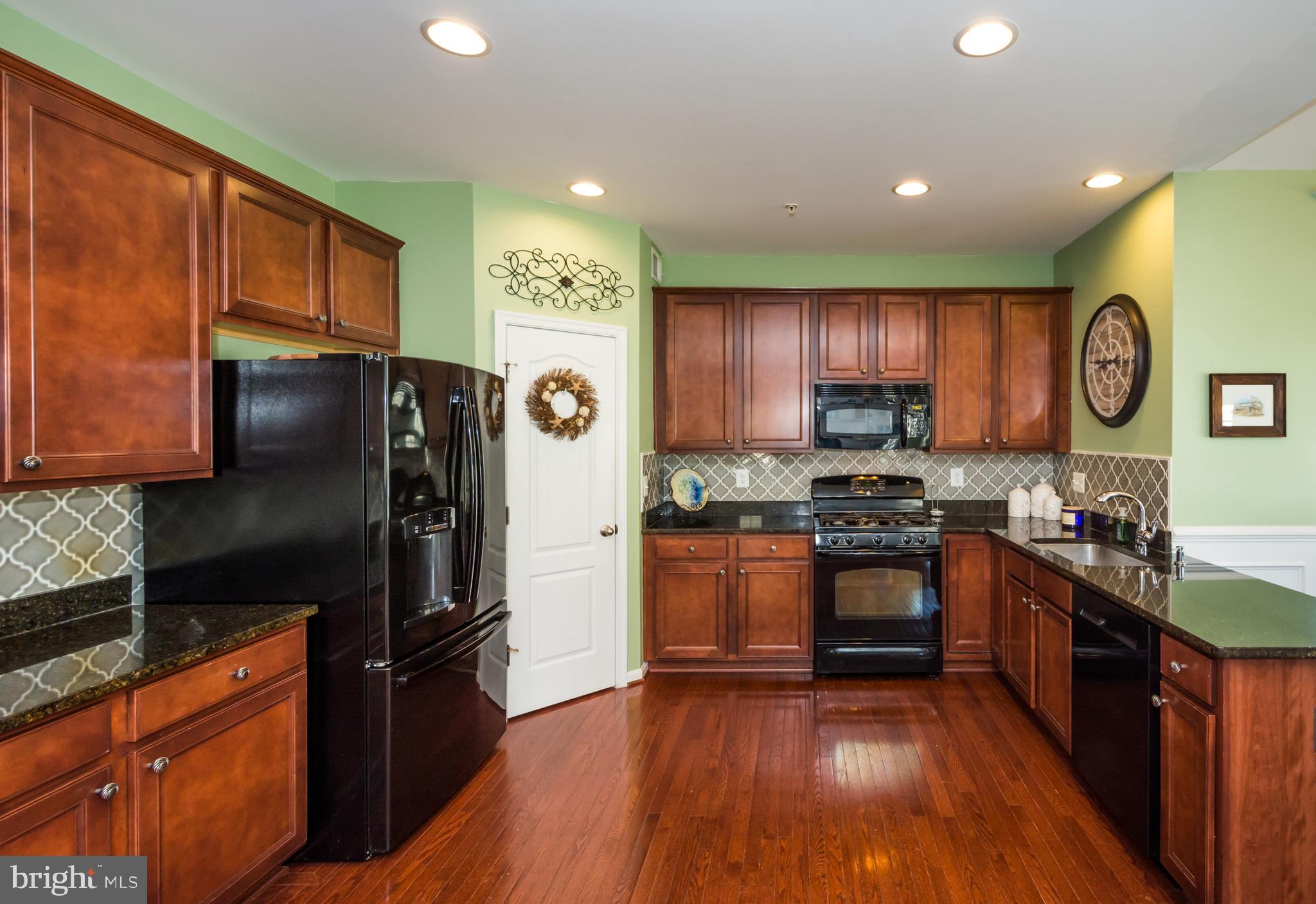 733 Daft Road Baltimore, MD 21220 - Photo 20 of 62 Kitchen with Gleaming Hardwood Floors