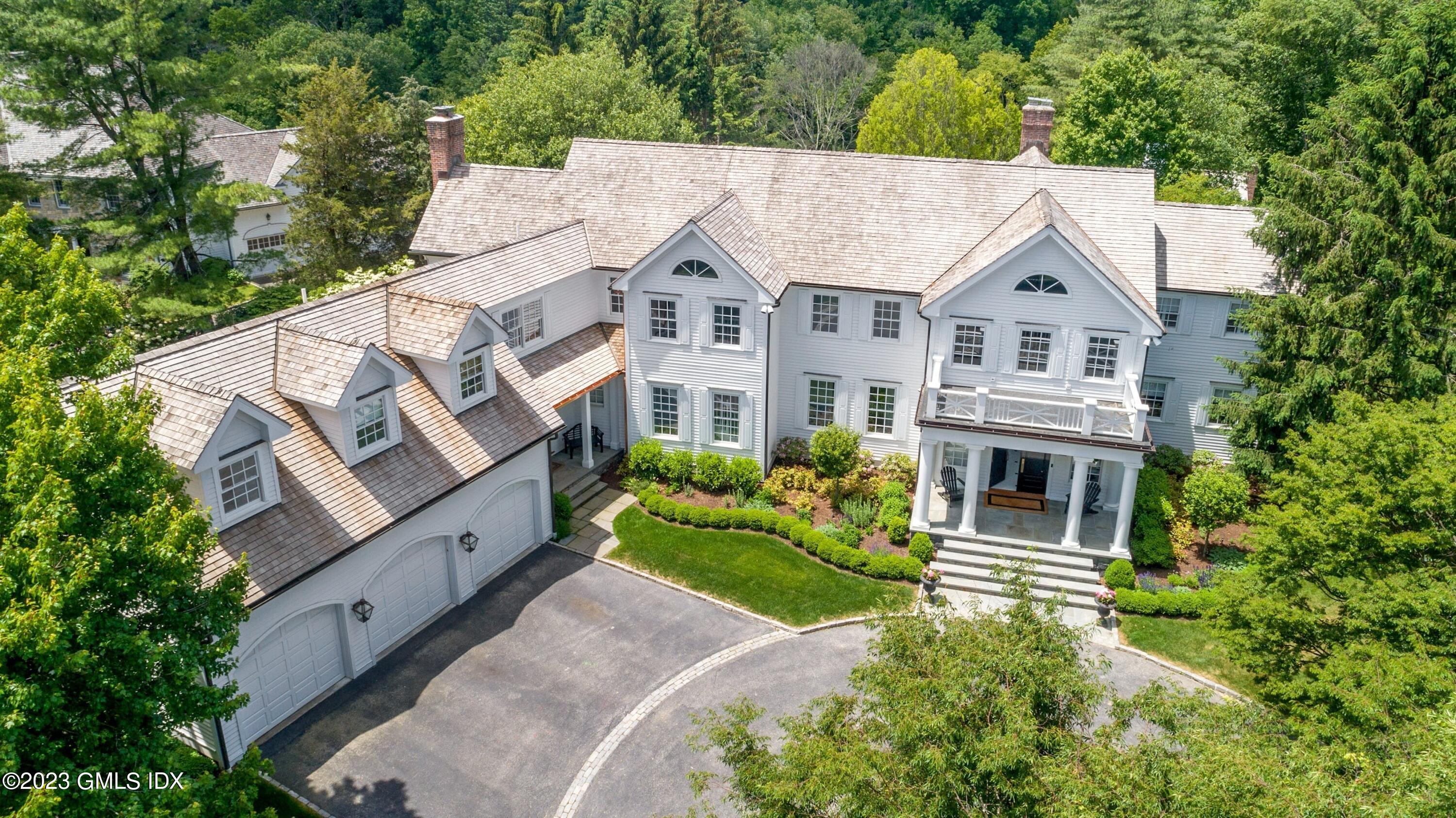 400 Stanwich Road Greenwich, CT 06830 - Photo 1 of 37 an aerial view of a house with a garden and plants