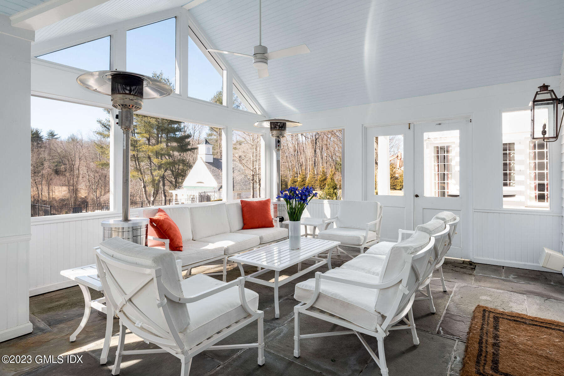 400 Stanwich Road Greenwich, CT 06830 - Photo 21 of 37 a dining room with furniture a chandelier and wooden floor