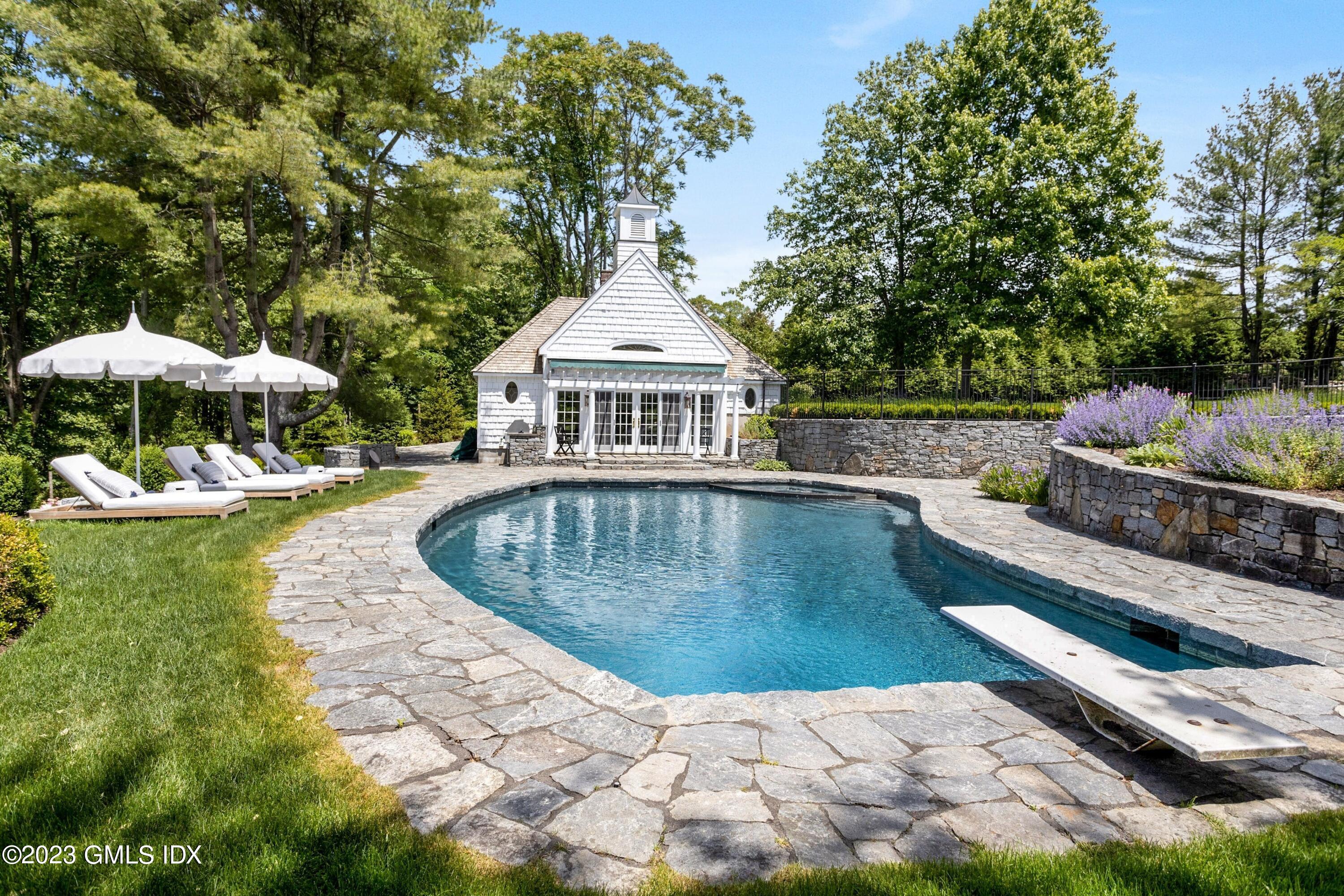 400 Stanwich Road Greenwich, CT 06830 - Photo 29 of 37 a view of a swimming pool with a patio