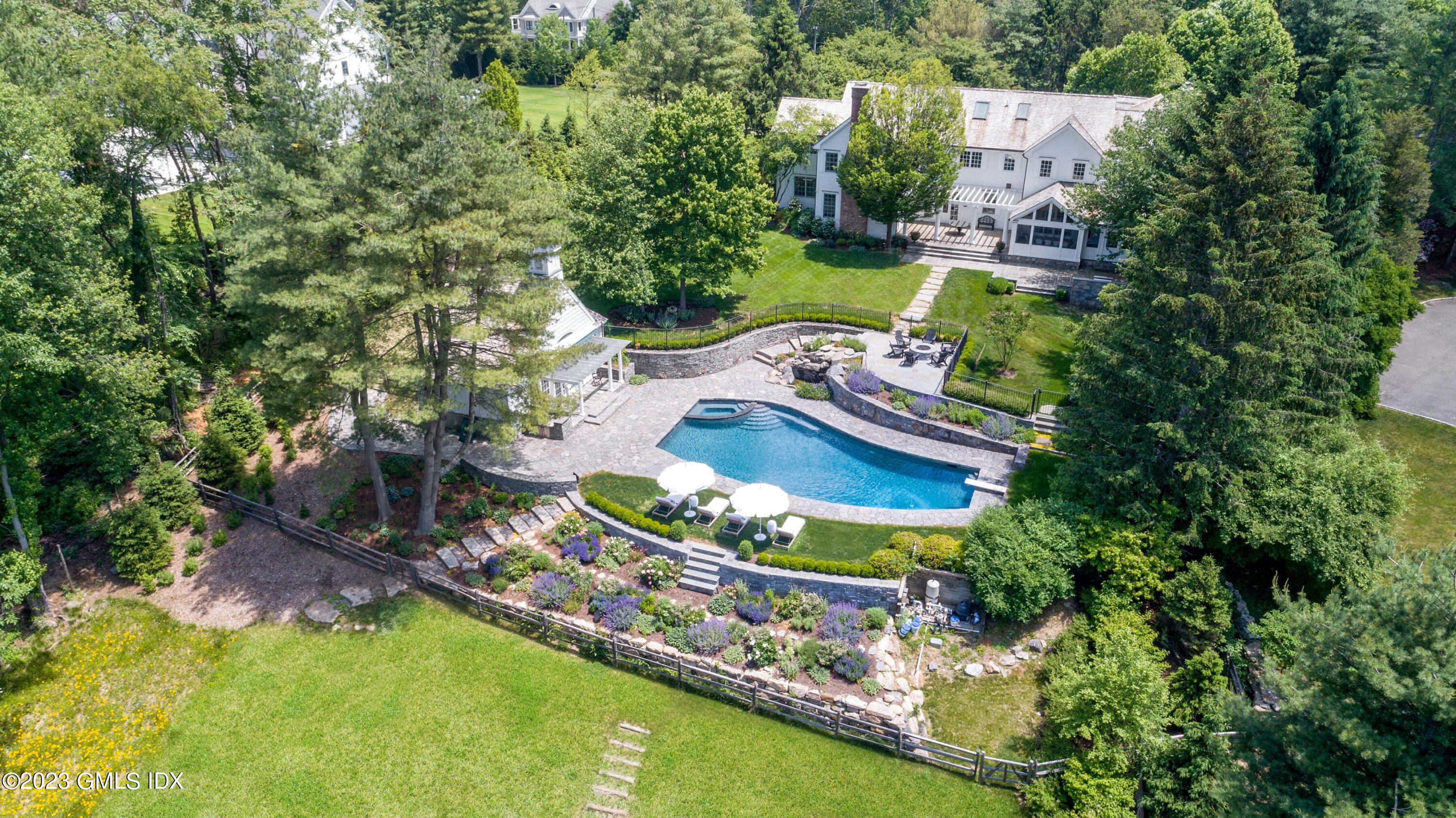 400 Stanwich Road Greenwich, CT 06830 - Photo 32 of 37 an aerial view of a house with a garden and lake view