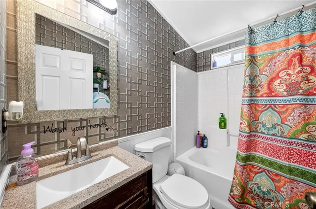 a bathroom with a sink toilet and bathtub