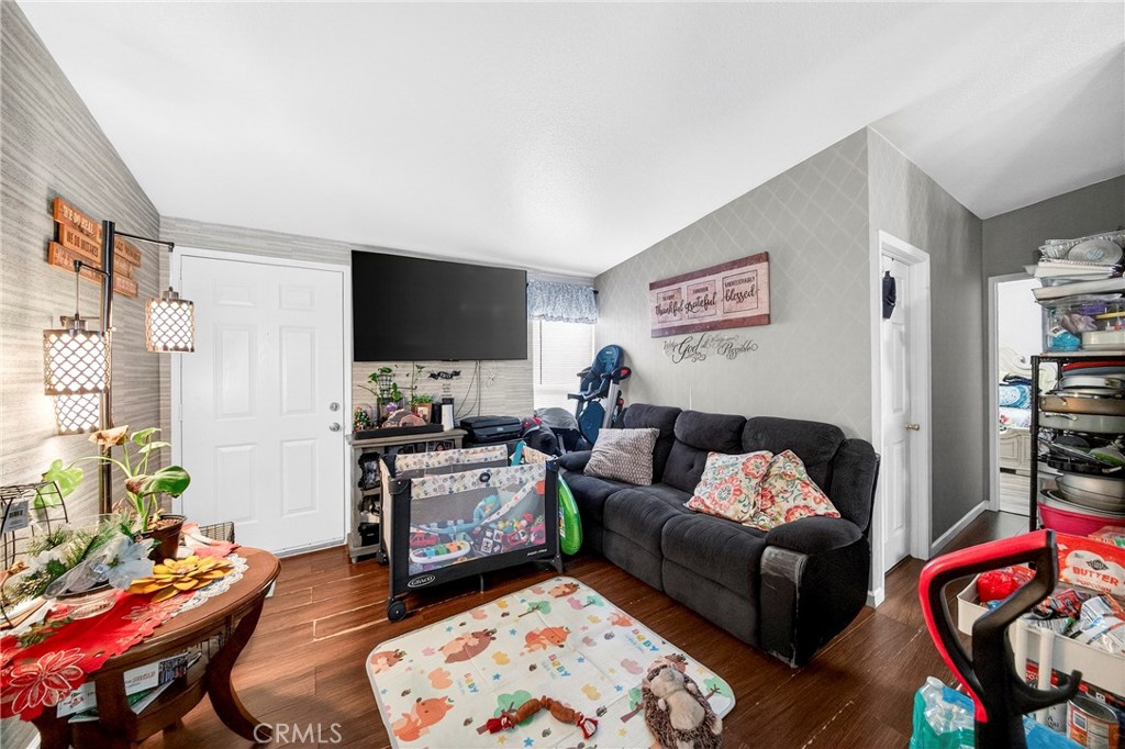 1241 North East Street Anaheim, CA 92805 - Photo 8 of 8 a living room with furniture and a flat screen tv