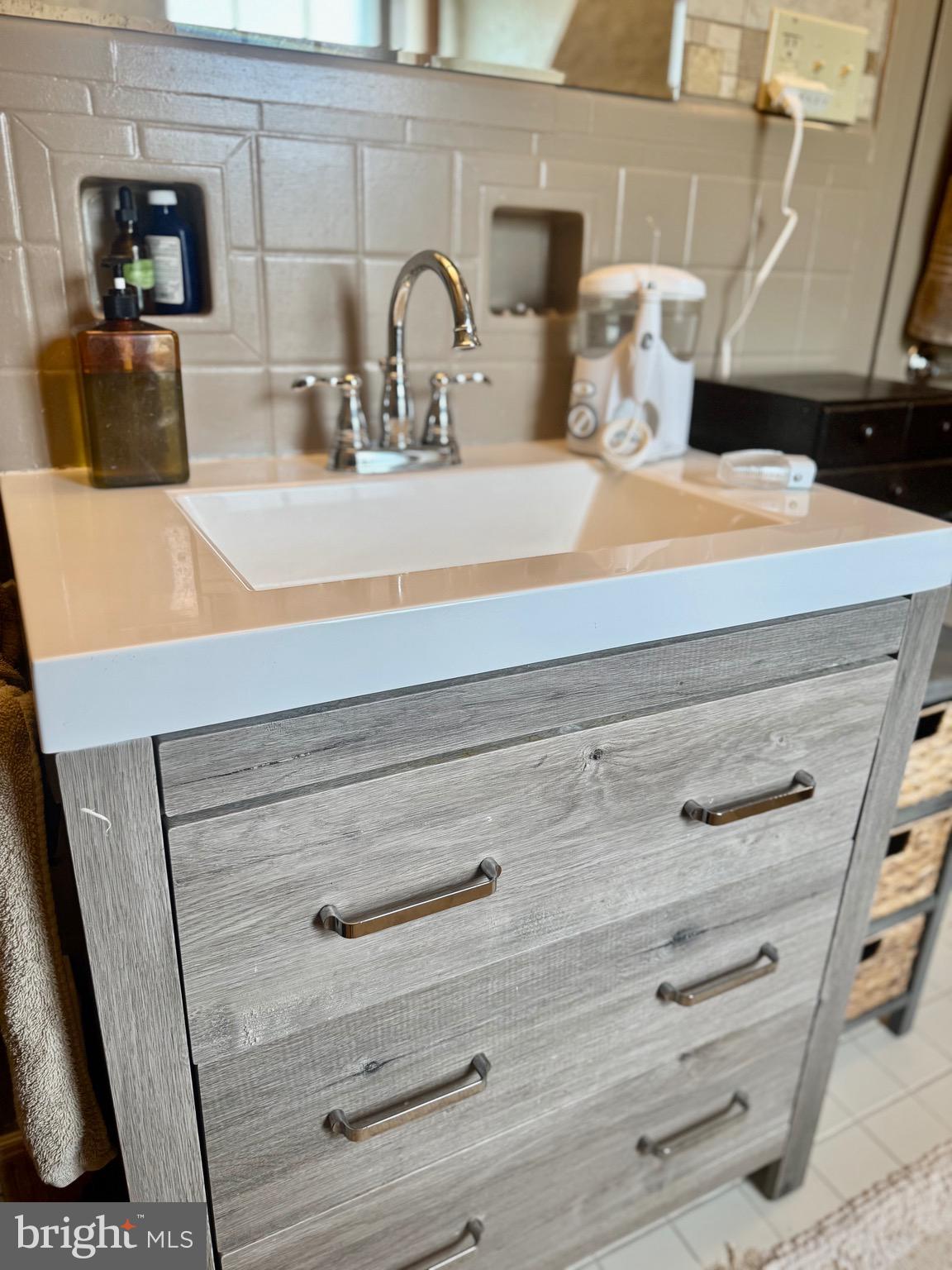2251 Moore Street Huntingdon, PA 16652 - Photo 78 of 106 a bathroom with a sink and a mirror