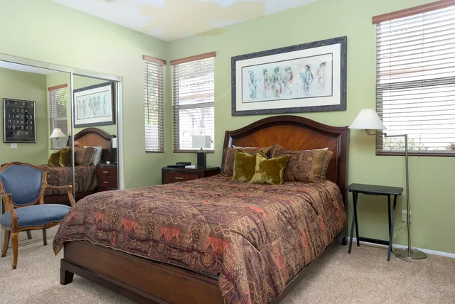 a bedroom with a bed and furniture