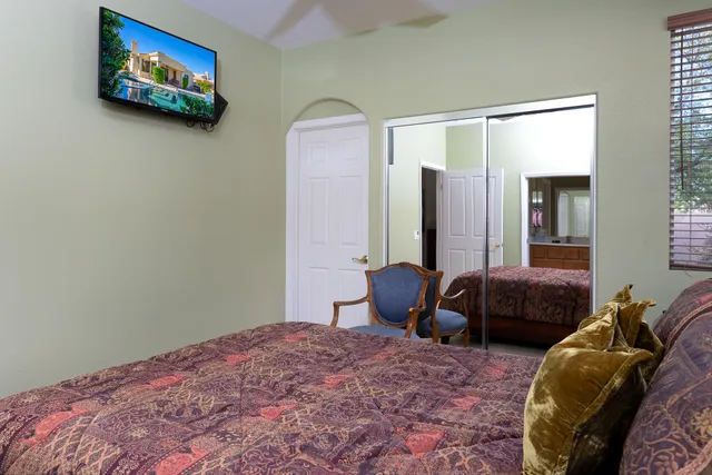 a bedroom with a bed and a couch