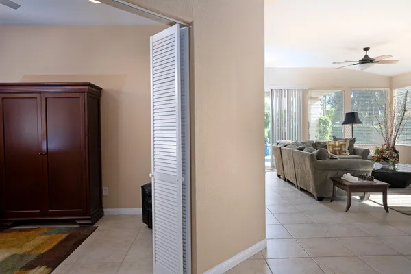 a view of a livingroom with furniture and a piano