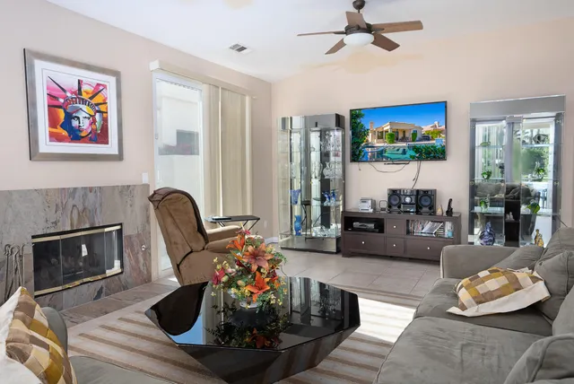 a living room with furniture and a fireplace