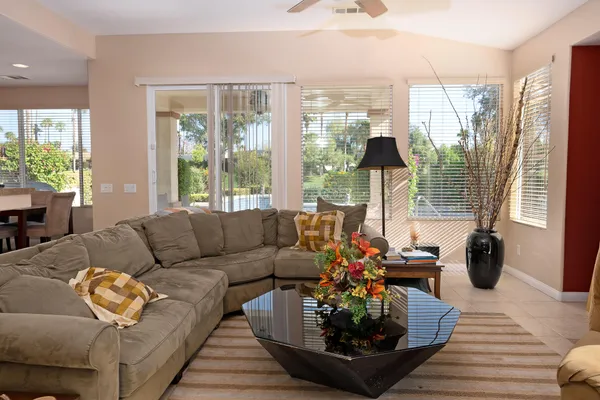 a living room with furniture and a large window