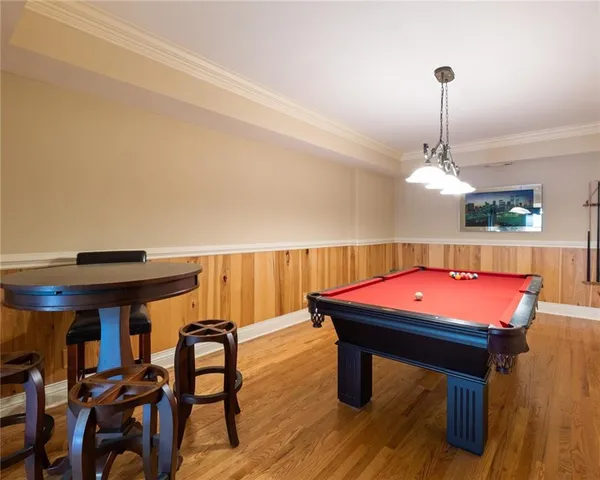 a room with furniture and pool table