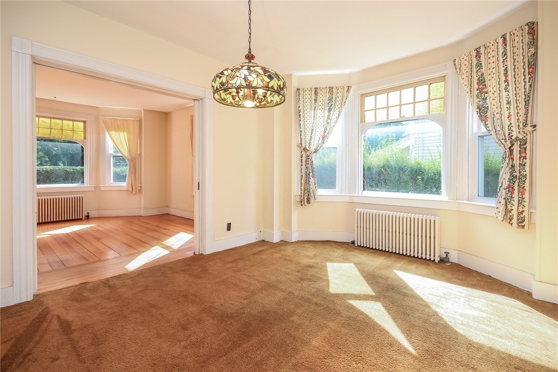 521 Spring Street Newport, RI 02840 - Photo 9 of 32 Dining room and living room