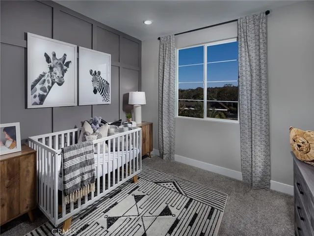 a view of a hallway with wooden floor and windows