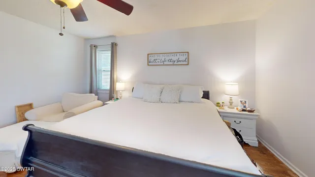 a room with a bed and a chandelier