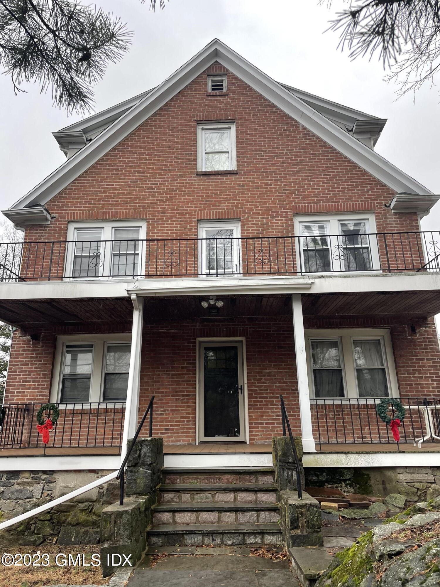 a front view of a house with balcony