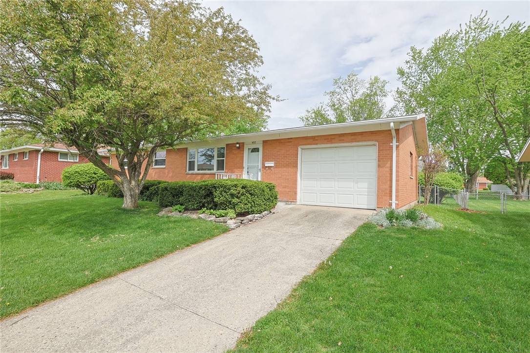 452 Cookston Avenue Springfield, OH 45503 - Photo 2 of 34 This classic brick residence features a spacious driveway and a pristine front lawn.