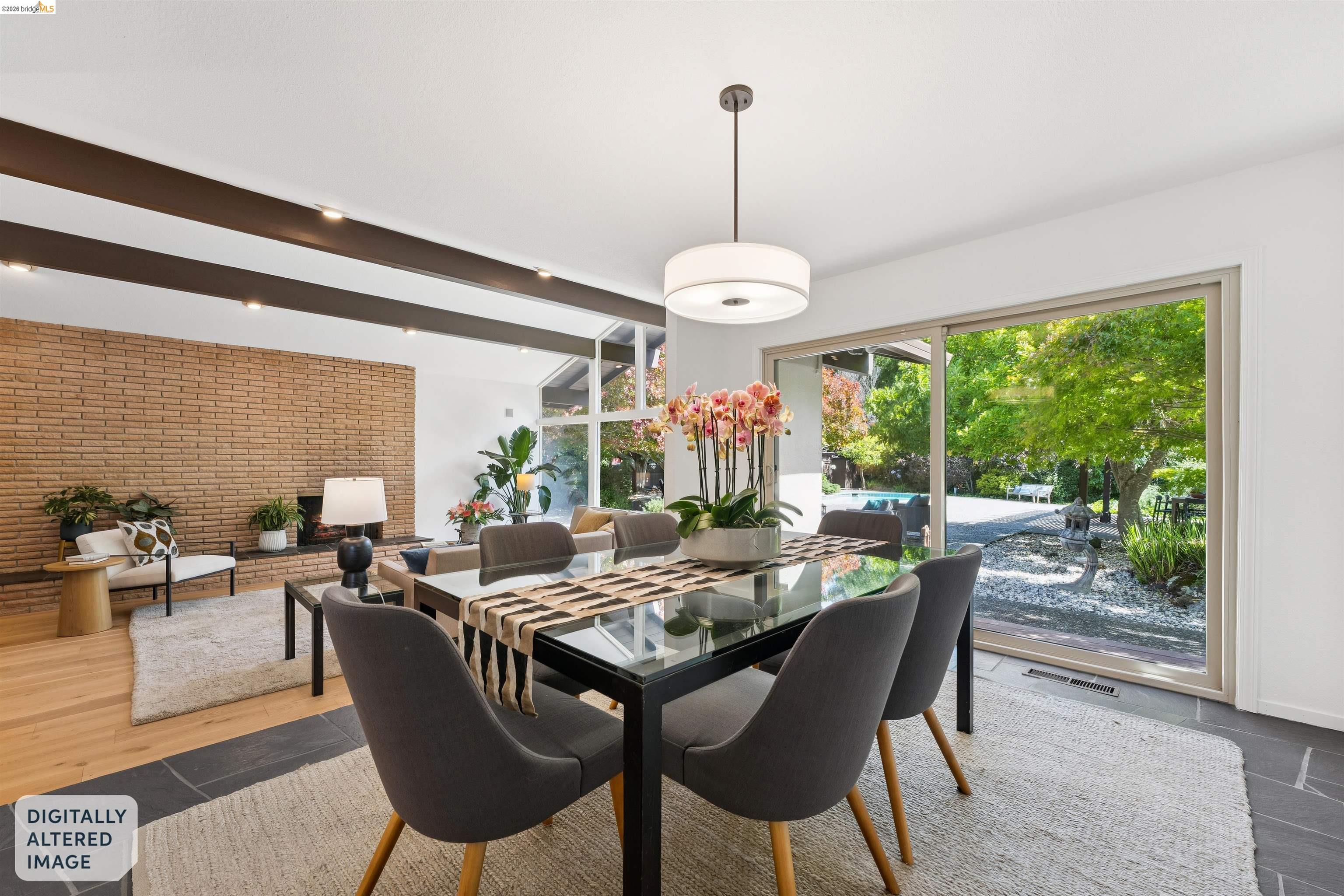 7 Jo Lin Court El Sobrante, CA 94803 - Photo 40 of 99 Dining area featuring a glass-top table, suspended pendant lighting, and sliding glass doors opening to the exterior