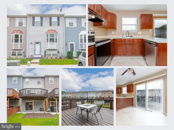 a kitchen with stainless steel appliances granite countertop a stove and a view of living room