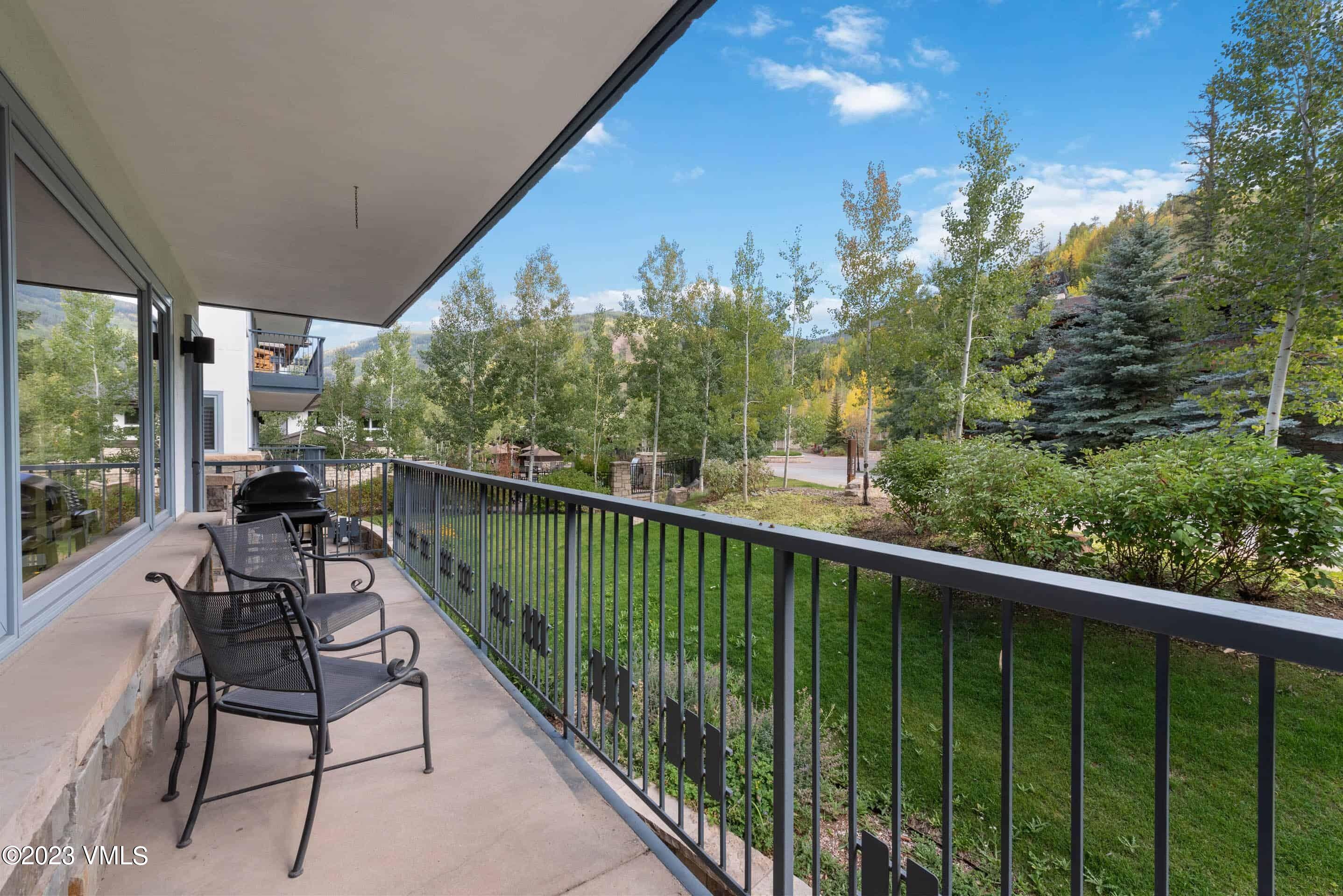 a balcony with chairs