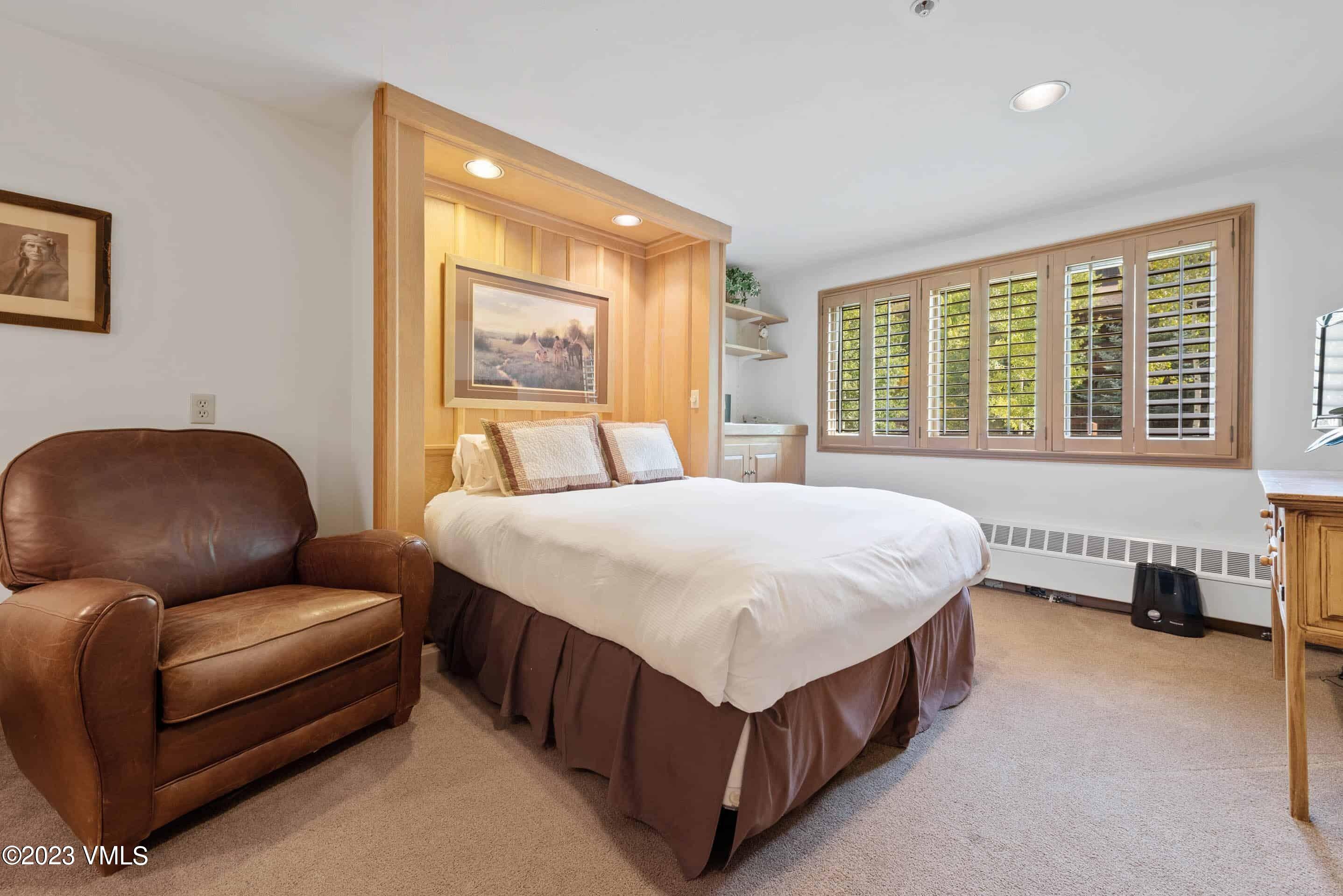 200 Vail Road, Unit 287 Vail, CO 81657 - Photo 13 of 21 a bed room with a bed and furniture