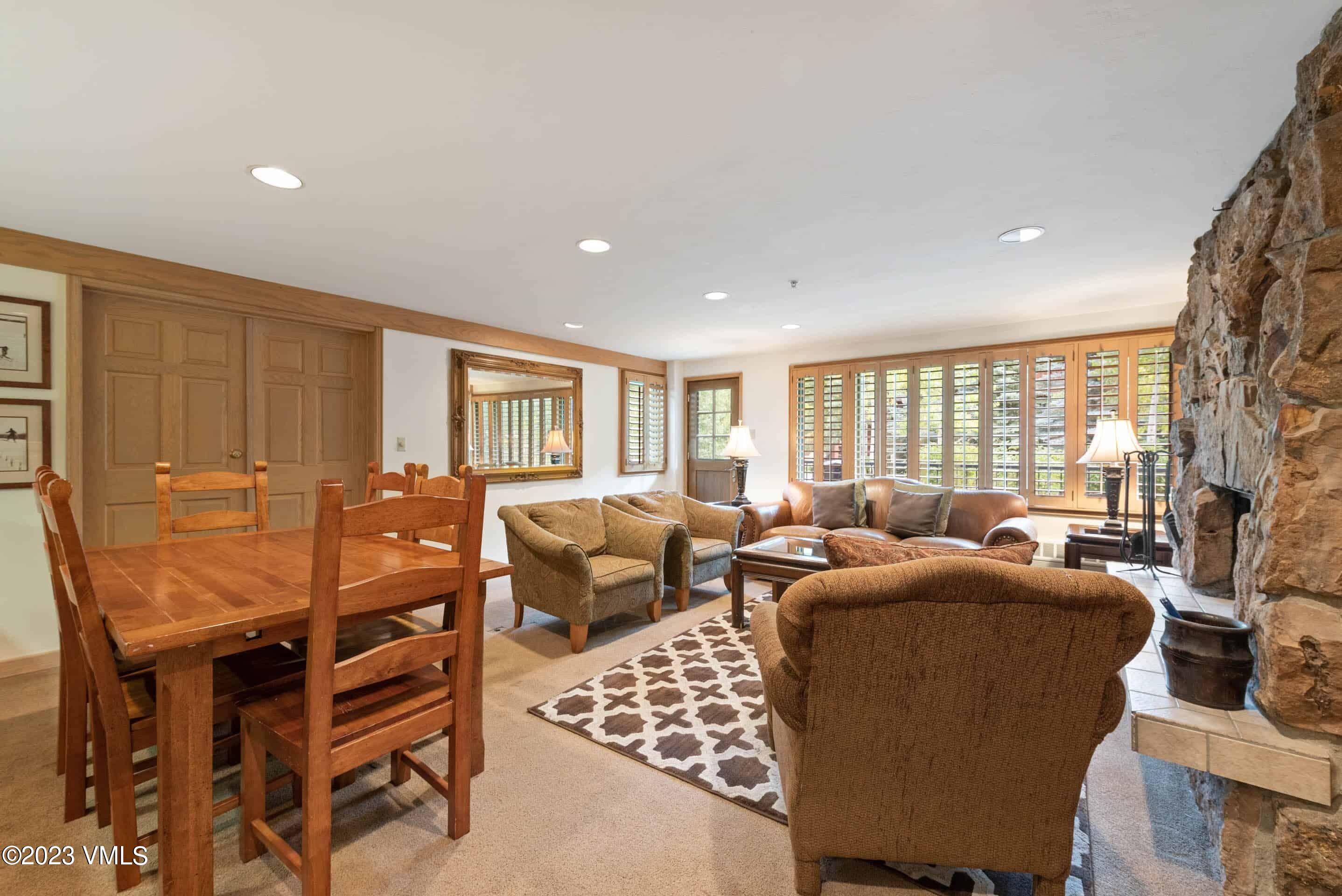 200 Vail Road, Unit 287 Vail, CO 81657 - Photo 7 of 21 a living room with furniture and a large window