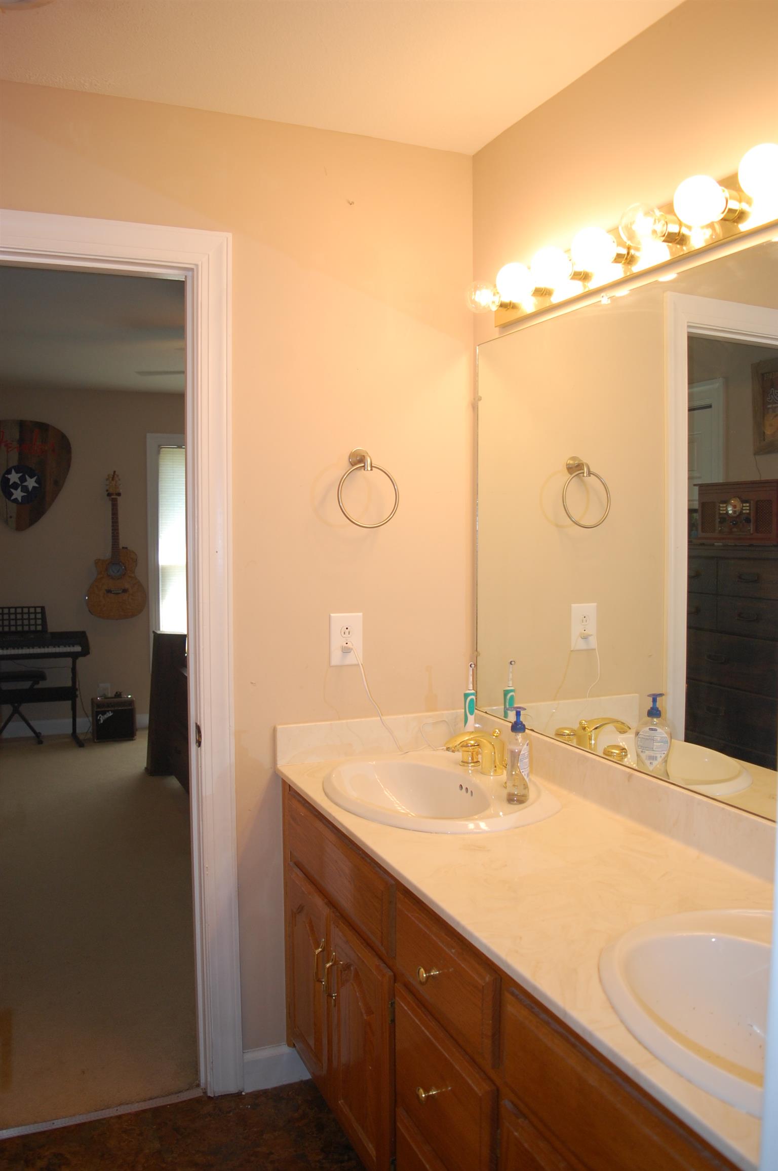 545 Pond Apple Road Clarksville, TN 37043 - Photo 15 of 22 A Jack & Jill Bathroom is Conveniently Nestled Between the Two Bigger Bedrooms - Featuring Double Vanities, No More Fighting Over The Sink!