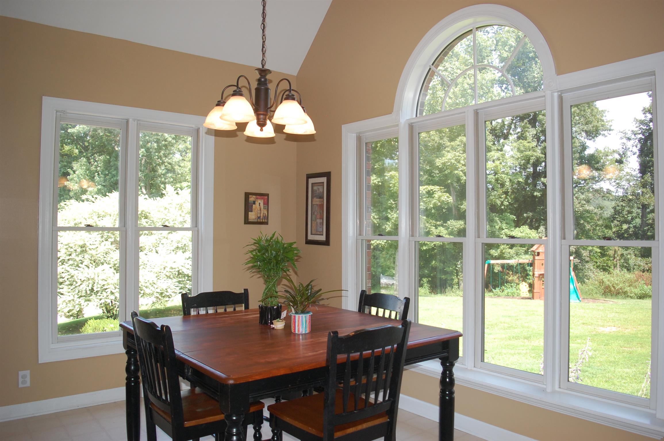 545 Pond Apple Road Clarksville, TN 37043 - Photo 3 of 22 The Eat-In Area is Surrounded By Perfect Windows With A View of the Beautiful Greenery Featured in the Backyard!