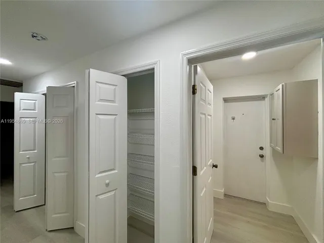 a bathroom with a shower and a glass door