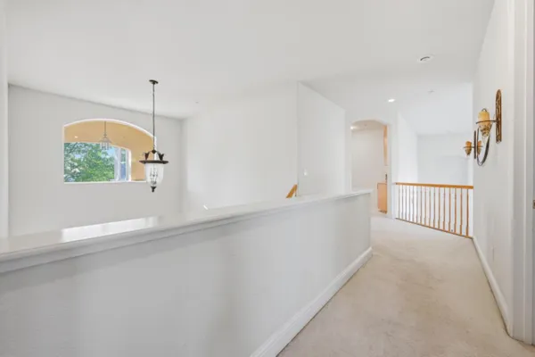 a view of a room with window and stairs