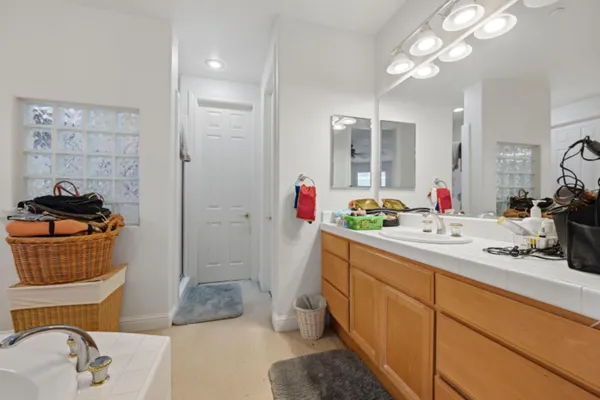a bathroom with a sink double vanity and a mirror