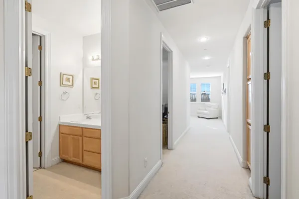 a view of a bathroom with a sink and mirror