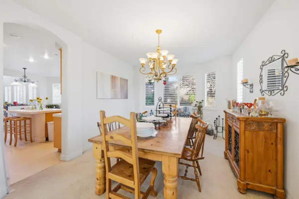 a dining room with furniture and window