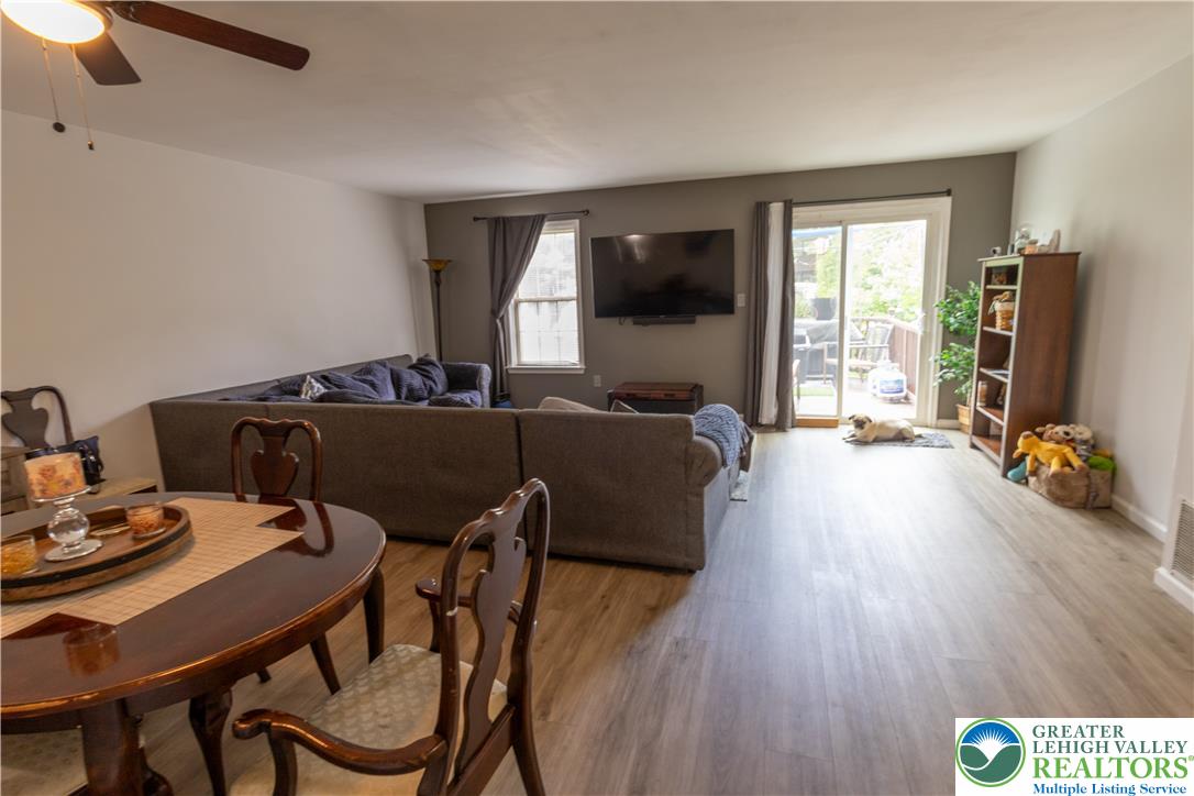 257 Ridgeview Drive Alburtis, PA 18011 - Photo 3 of 24 An open-concept living and dining area features abundant natural light and wood-look flooring.