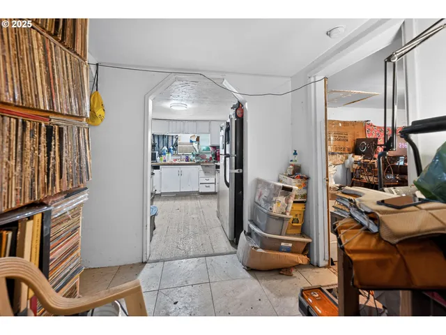 a view of livingroom with furniture and workspace