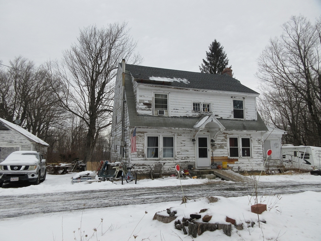 78 Main Street Blandford, MA 01008 - Photo 1 of 8 a front view of a house with a yard