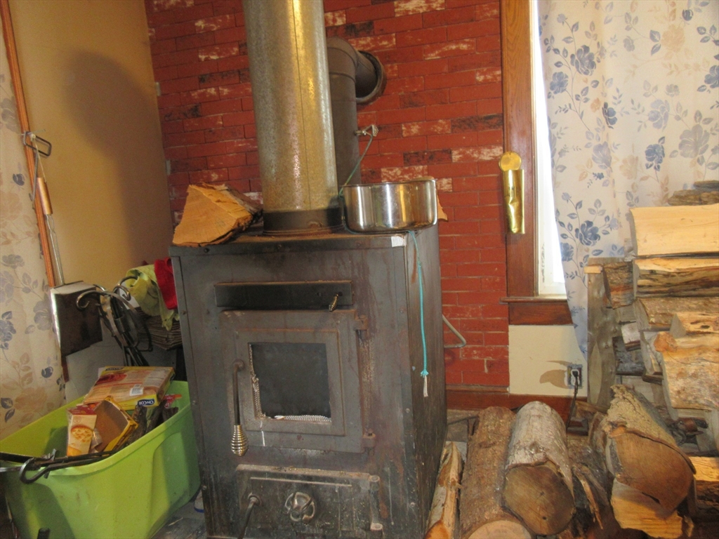 78 Main Street Blandford, MA 01008 - Photo 4 of 8 a living room with furniture and a fireplace